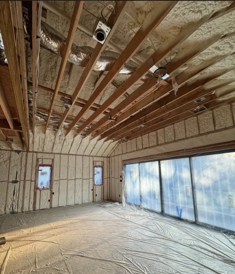 Interior walls and ceiling insulated with spray foam during new construction in Athens